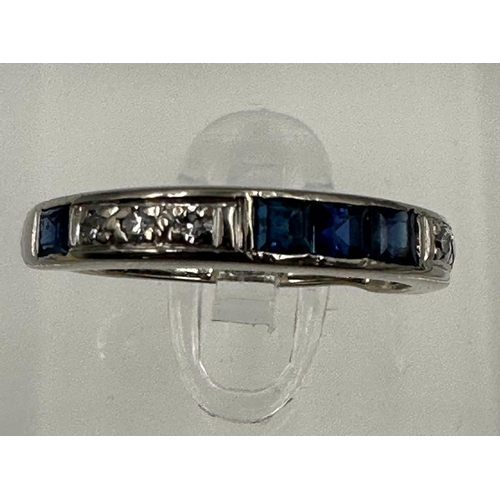 583 - A diamond and sapphire, half eternity style ring set in 18ct white gold, approximate size M