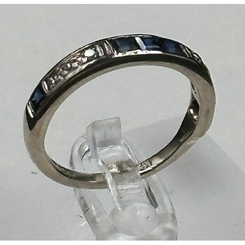 583 - A diamond and sapphire, half eternity style ring set in 18ct white gold, approximate size M