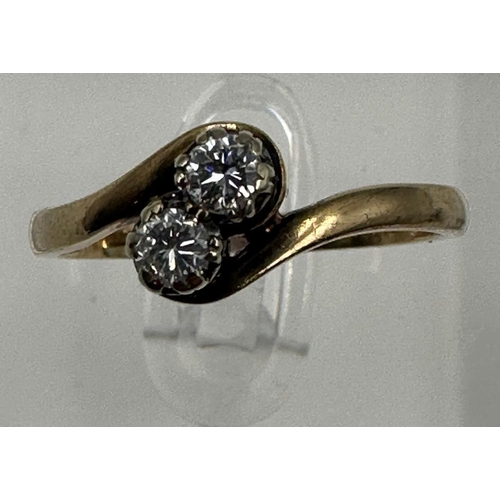 588 - A two stone diamond ring on a 9ct gold setting, approximate size P and weight 2.6g.