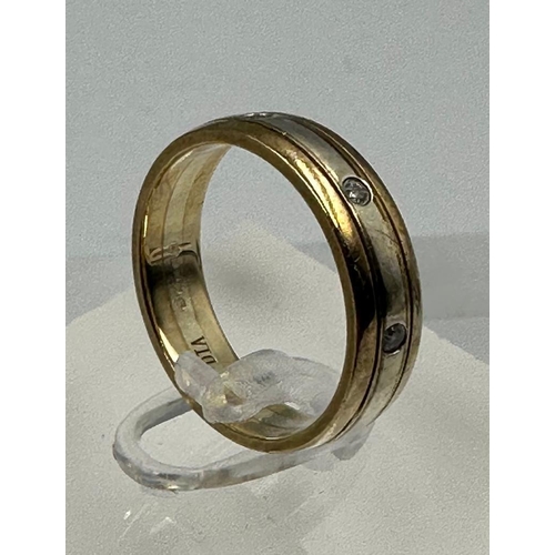 589 - A 9ct gold band with diamond insets, approximate total weight 4.3g and size N