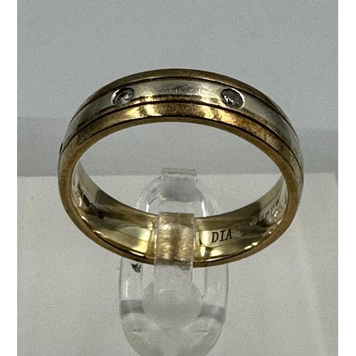 589 - A 9ct gold band with diamond insets, approximate total weight 4.3g and size N