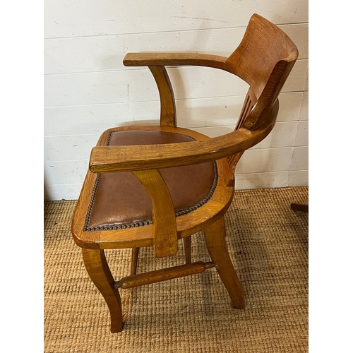 59 - An oak desk chair Edwardian style leather seat and studded detail