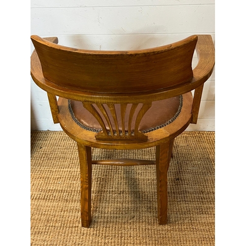 59 - An oak desk chair Edwardian style leather seat and studded detail