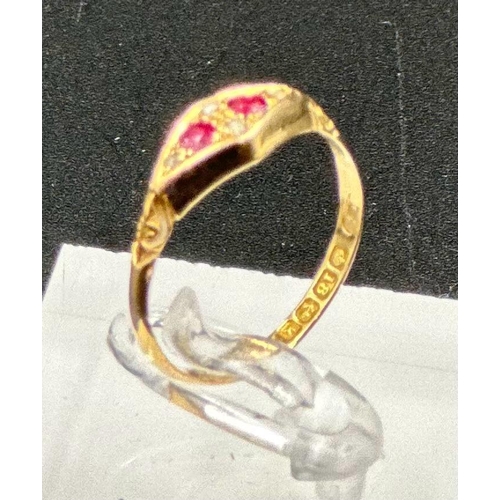 590 - An 18ct gold antique ring with inset rubies and ornate design, approximate total weight 2.1g and siz... 