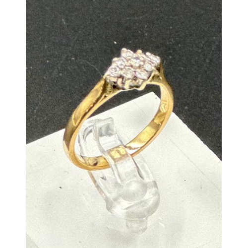 591 - A 9ct gold ring with diamond cluster setting, approximate total weight 2.5g, size N