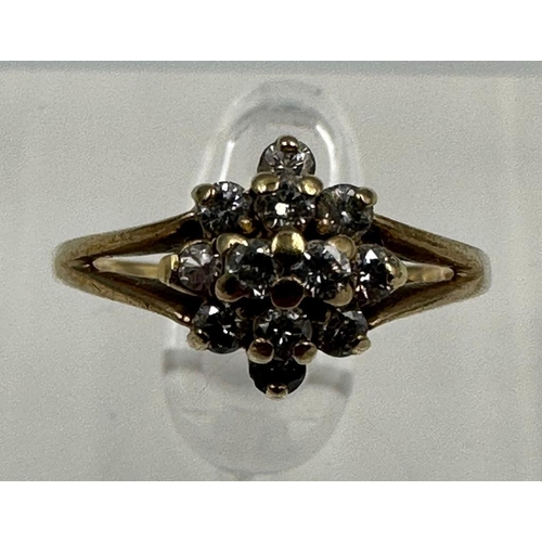 596 - A 9ct gold and diamond ring, approximate size M