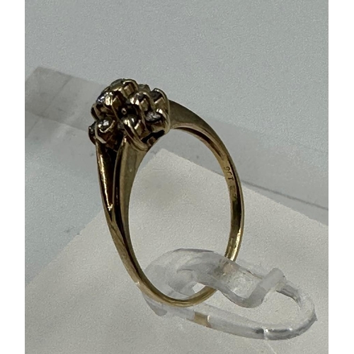 596 - A 9ct gold and diamond ring, approximate size M