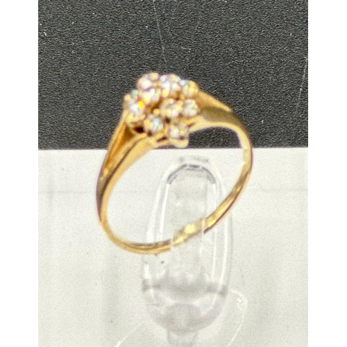 596 - A 9ct gold and diamond ring, approximate size M