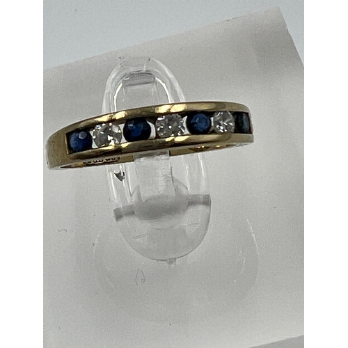 601 - A 9ct gold diamond and sapphire ring, approximate size I.