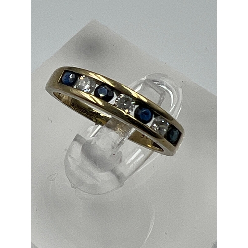 601 - A 9ct gold diamond and sapphire ring, approximate size I.