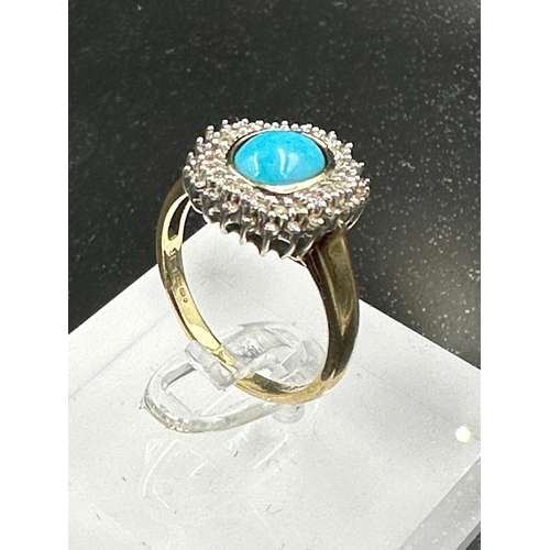 610 - A 9ct gold diamond and turquoise ring. (Approximate Total Weight 3.7g) Size P1/2