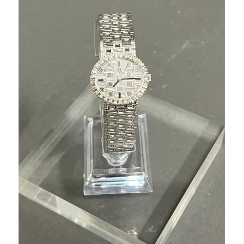 614 - A Ladies 18ct gold and diamond Omega watch, textured white dial, black hourly makers, a 17 jewel man... 