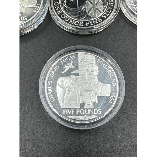 651 - A selection of five silver commemorative coins including a 2008 Britannia.