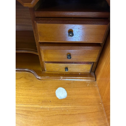 66 - A yew bureau bookcase comprising of a glazed two shelf bookcase and a red leather topped bureau with... 