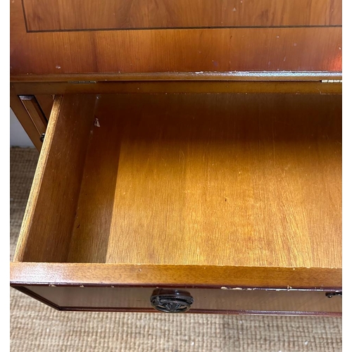 66 - A yew bureau bookcase comprising of a glazed two shelf bookcase and a red leather topped bureau with... 