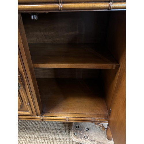 69 - A bamboo effect glazed cabinet with two glass shelves and three embossed cupboards under (H200cm W13... 