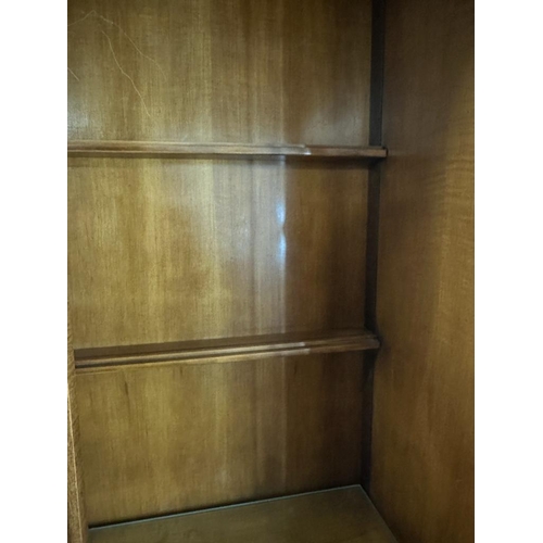 69 - A bamboo effect glazed cabinet with two glass shelves and three embossed cupboards under (H200cm W13... 