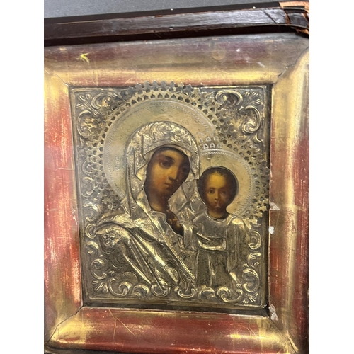 690 - A Russian icon in glazed case 18cm x 20cm