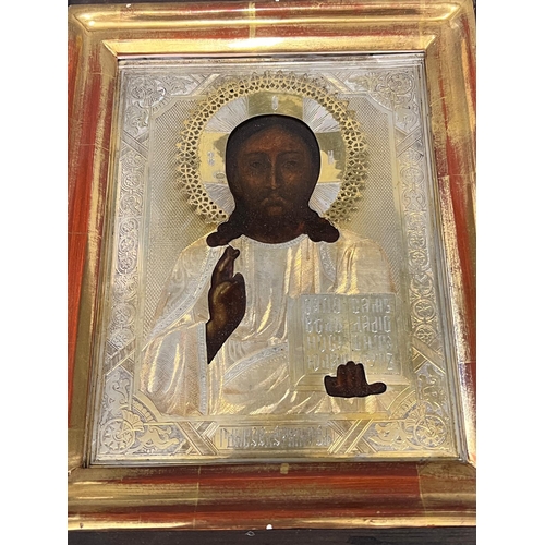 691 - A Russian icon in glazed cased 24cm x 29cm