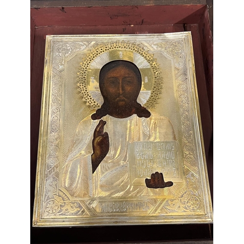 691 - A Russian icon in glazed cased 24cm x 29cm