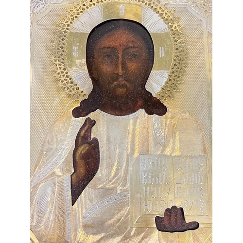 691 - A Russian icon in glazed cased 24cm x 29cm