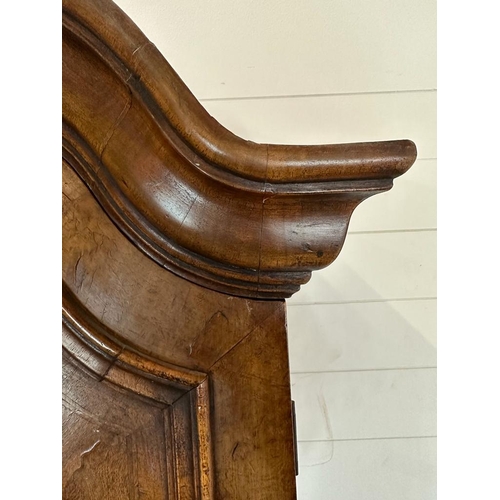 7 - A Queen Anne revival walnut panelled cabinet on two over three chest with block feet, brass handles ... 