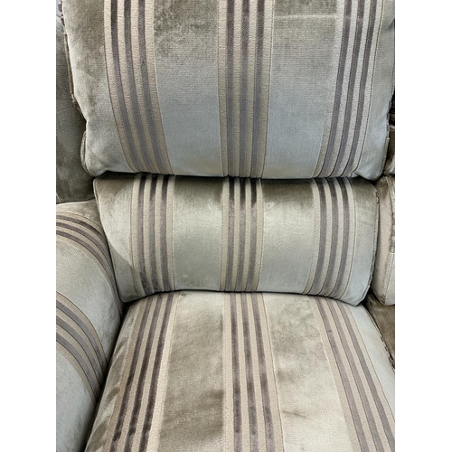 70 - A two seater Parker Knoll sofa upholstered in stripe greys and greens