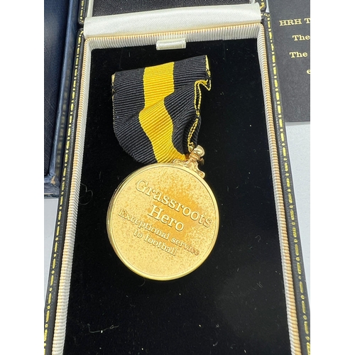 713 - A collection of FA medals and memorabilia items