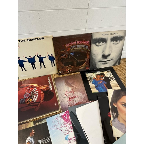 735 - A selection of vinyl LP to include The Beatles Help, Chic and Phil Collins