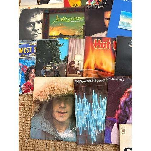 738 - A selection of vinyl Lps to include Cliff Richards (signed), Paul Simon and Joni Mitchell