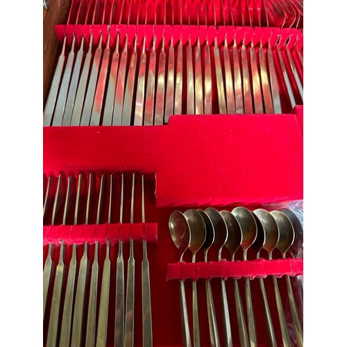 744 - A vintage VU bronze and nickel canteen of cutlery and flatware