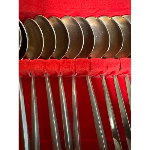 744 - A vintage VU bronze and nickel canteen of cutlery and flatware