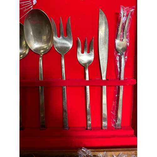 744 - A vintage VU bronze and nickel canteen of cutlery and flatware