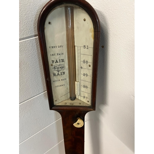 747 - A Mid Victorian figured walnut stick barometer