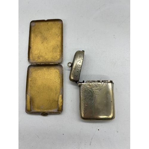 752 - Two white metal vesta cases and one brass