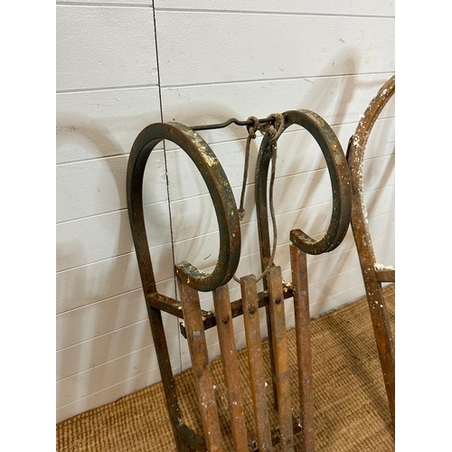 786 - A metal framed vintage sled and a Bentwood vintage sled