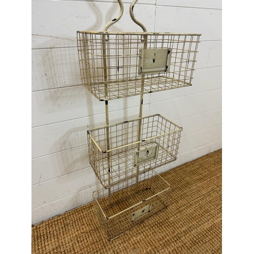 79 - A farm house distressed finish wire wall, mounted three tier storage rack