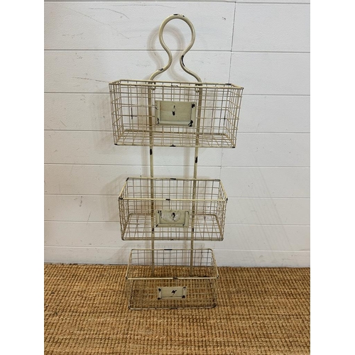 79 - A farm house distressed finish wire wall, mounted three tier storage rack