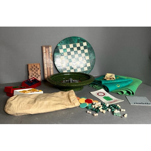 794 - A selection of games and gaming tokens to include chess board and pieces, cribbage board and a roule... 