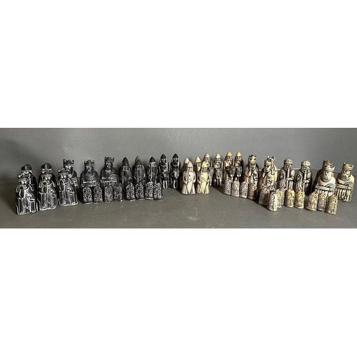 797 - A selection of Isle of Lewis black and white chess pieces to include Kings, Queens, Bishops, Knights... 