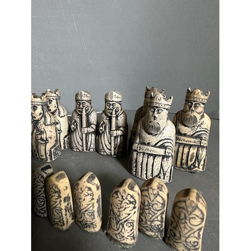 797 - A selection of Isle of Lewis black and white chess pieces to include Kings, Queens, Bishops, Knights... 