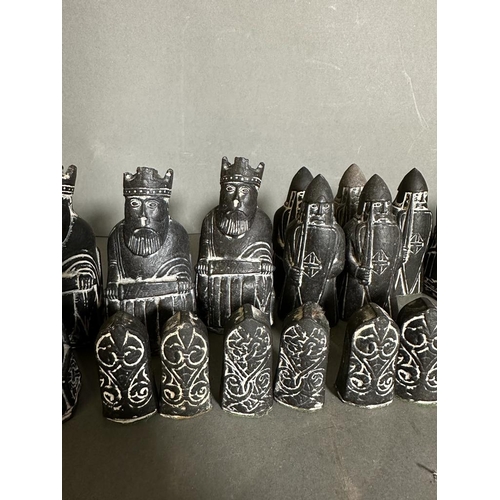 797 - A selection of Isle of Lewis black and white chess pieces to include Kings, Queens, Bishops, Knights... 