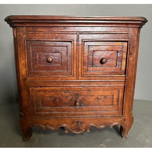 84 - A small mahogany desk top two over one chest of drawers (H32cm W32cm D23cm)