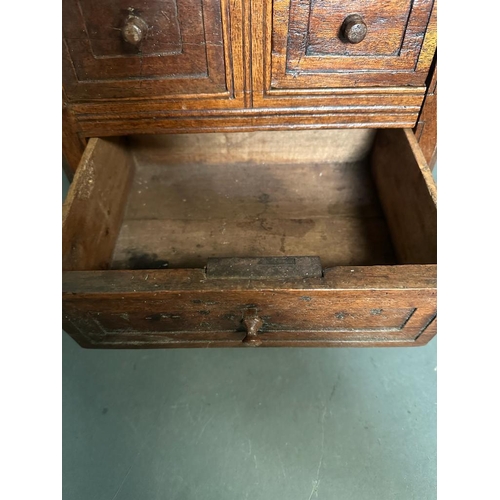 84 - A small mahogany desk top two over one chest of drawers (H32cm W32cm D23cm)