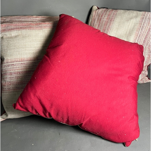 94 - Four square throw cushions with red strips