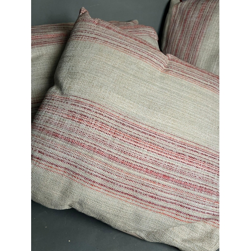 94 - Four square throw cushions with red strips