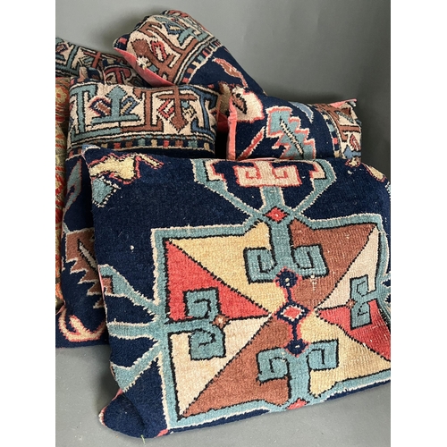 95 - A selection of rustic Persian style rug pillows