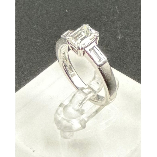 555A - Diamond ring with centrally set emerald cut diamond, approx 6.48mm x 5.03mm x 3.34mm, stated weight ... 