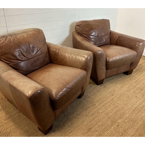 1 - A pair of brown leather club arm chairs