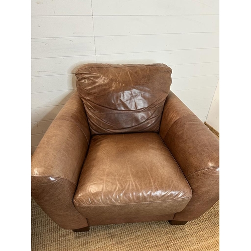 1 - A pair of brown leather club arm chairs